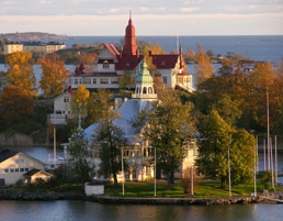 Red houses riverbank by Gary Wornell - Visit Finland